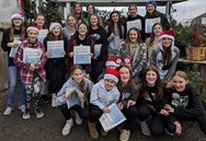 Volleyball teams bond while raising money for Hope for the Holidays